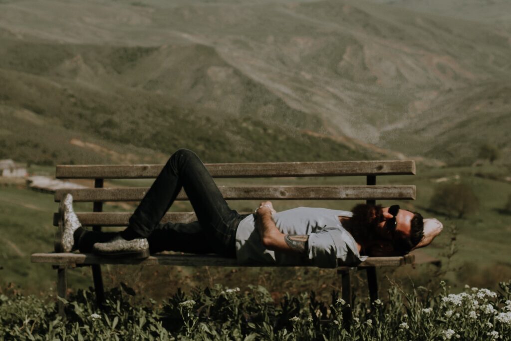 Photo by Anastasiya Lobanovskaya: https://www.pexels.com/photo/man-lying-on-brown-wooden-bench-842292/