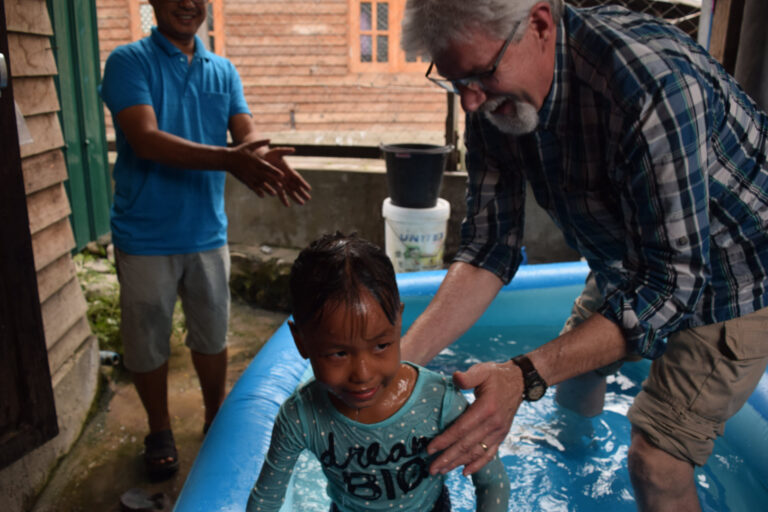 Water baptizing an orphan