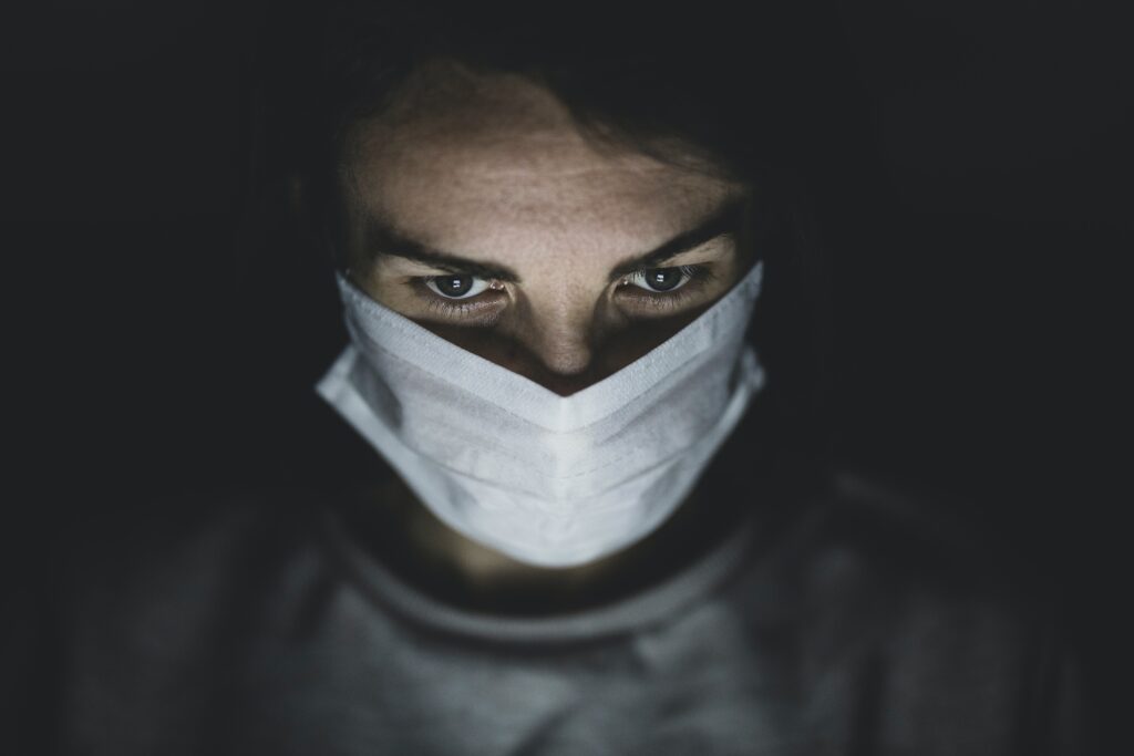 Photo by Engin Akyurt: https://www.pexels.com/photo/man-wearing-face-mask-in-a-dark-room-4031915/